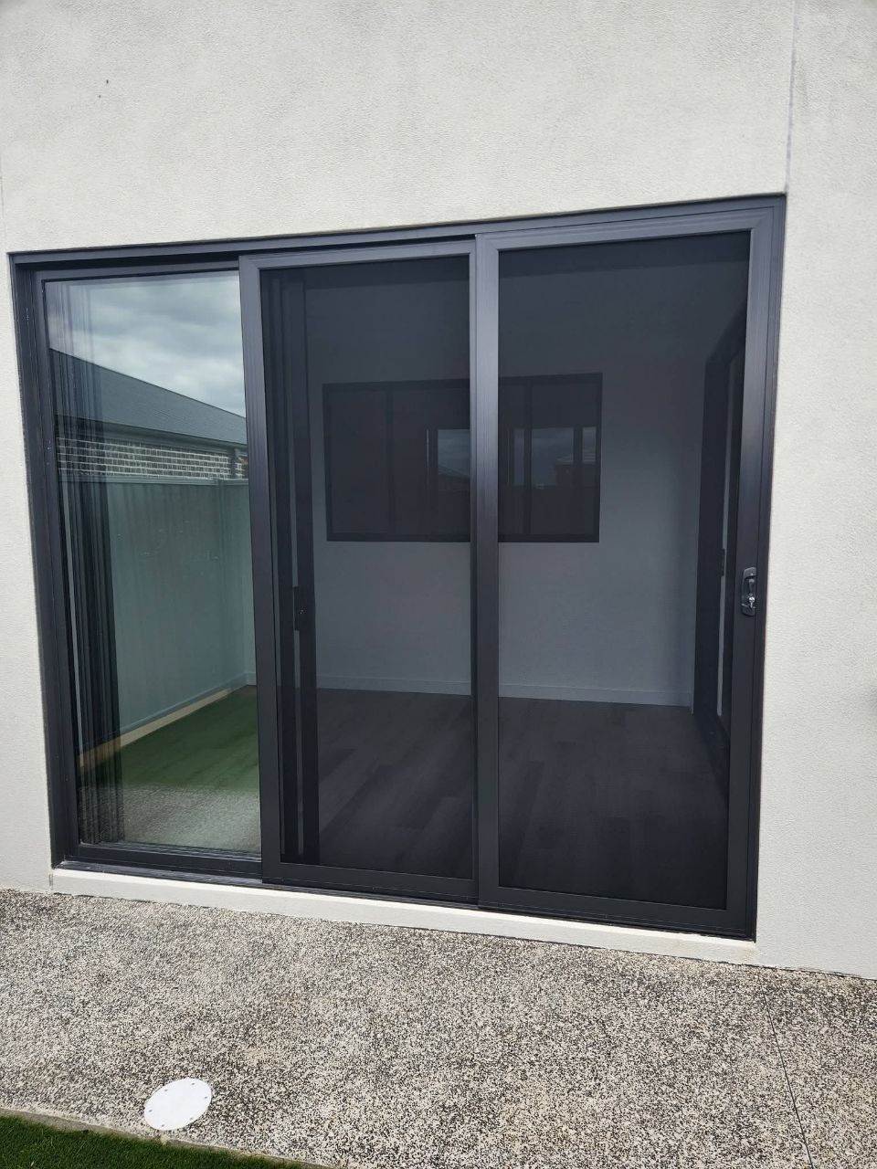 Sliding glass door with integrated security screen